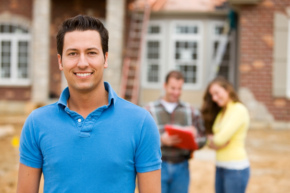 Man in Front of His New Home Construction