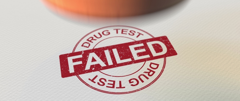 A photograph of a heavily textured page stamped in red ink reading "drug test" and "Failed". The stamp is bold and circular.