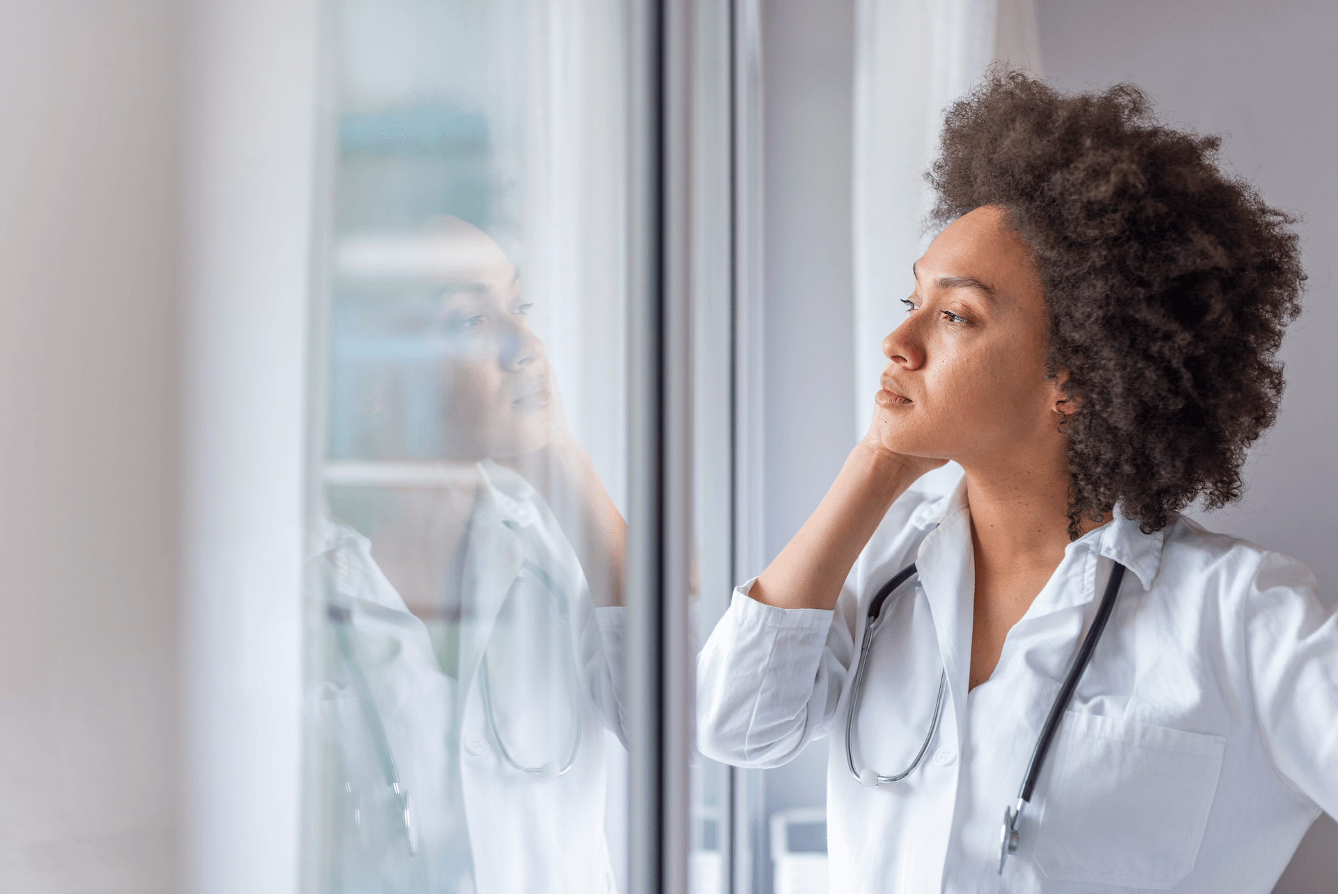 Physician looking out window